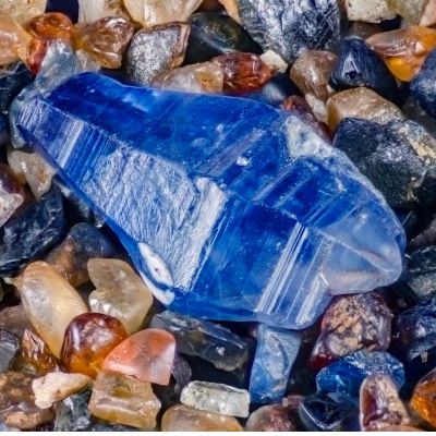 Blue sapphire gemstone in it's rough crystal form before starting the cutting process
